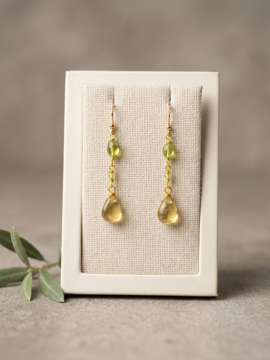 Adella - featuring Smooth Natural Peridot Flat Ovals, Faceted Natural Peridot Rounds, Smooth Grossular Garnet Briolettes, Gold Plated Stainless Steel Wire, Gold Plated Copper Wire, Gold Plated Brass Chain, Gold Plated Stainless Steel Ear Hooks angle 3