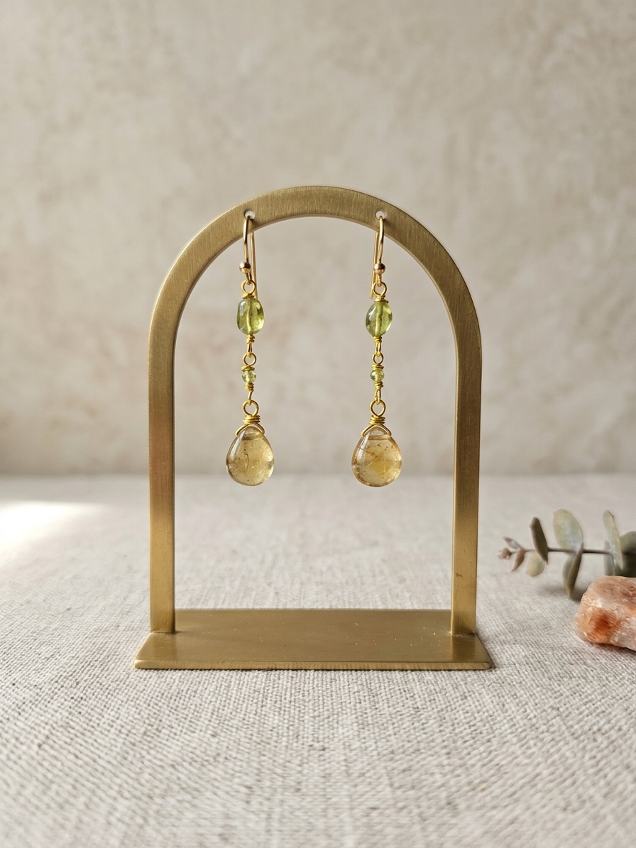 Adella - featuring Smooth Natural Peridot Flat Ovals, Faceted Natural Peridot Rounds, Smooth Grossular Garnet Briolettes, Gold Plated Stainless Steel Wire, Gold Plated Copper Wire, Gold Plated Brass Chain, Gold Plated Stainless Steel Ear Hooks
